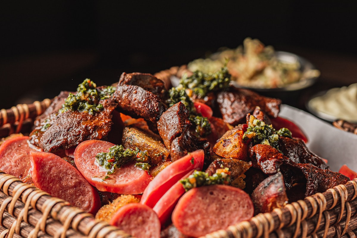 A basket filled with grilled meats and sausages